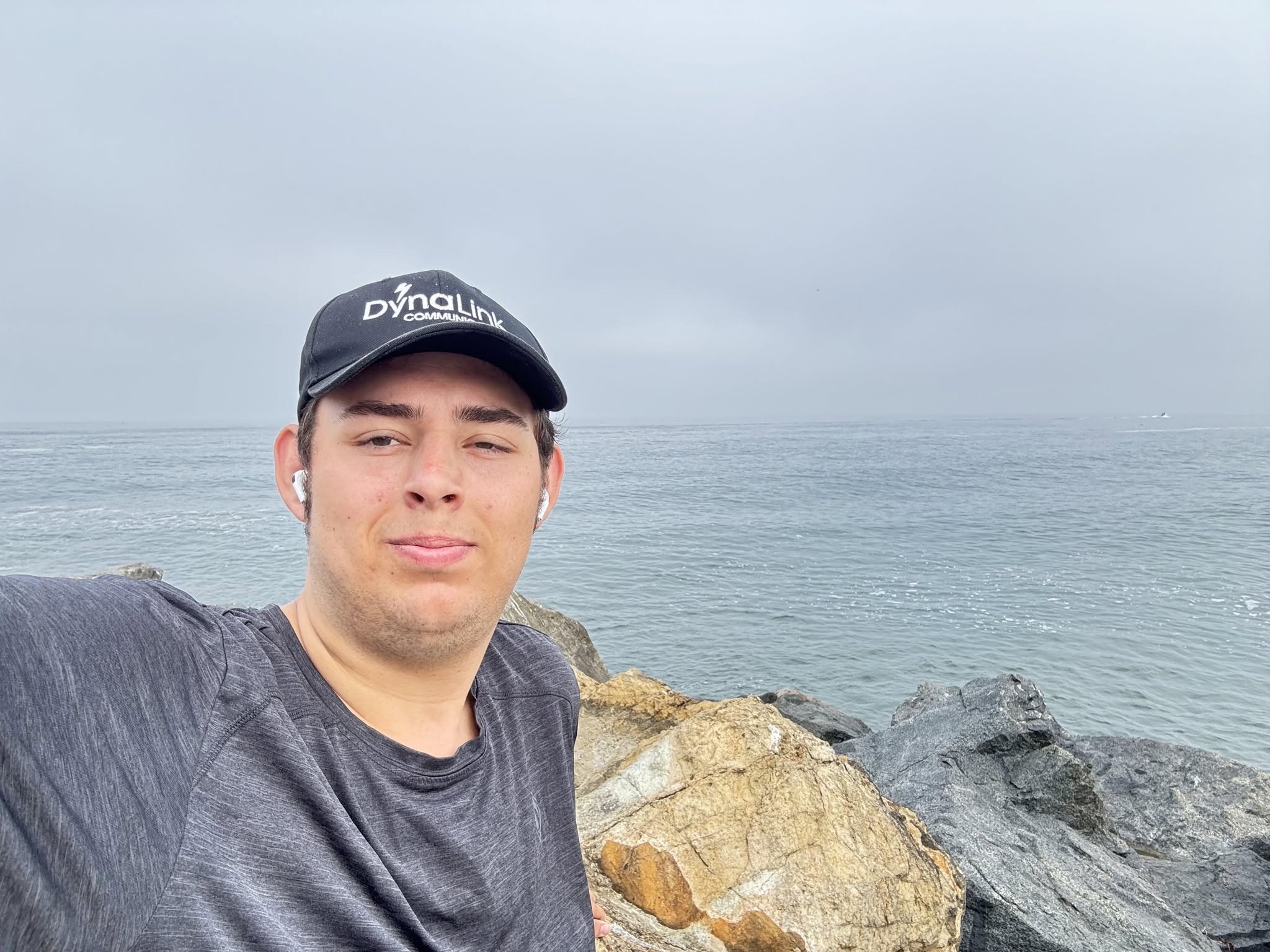 Adam Leveille outdoors beside the ocean.