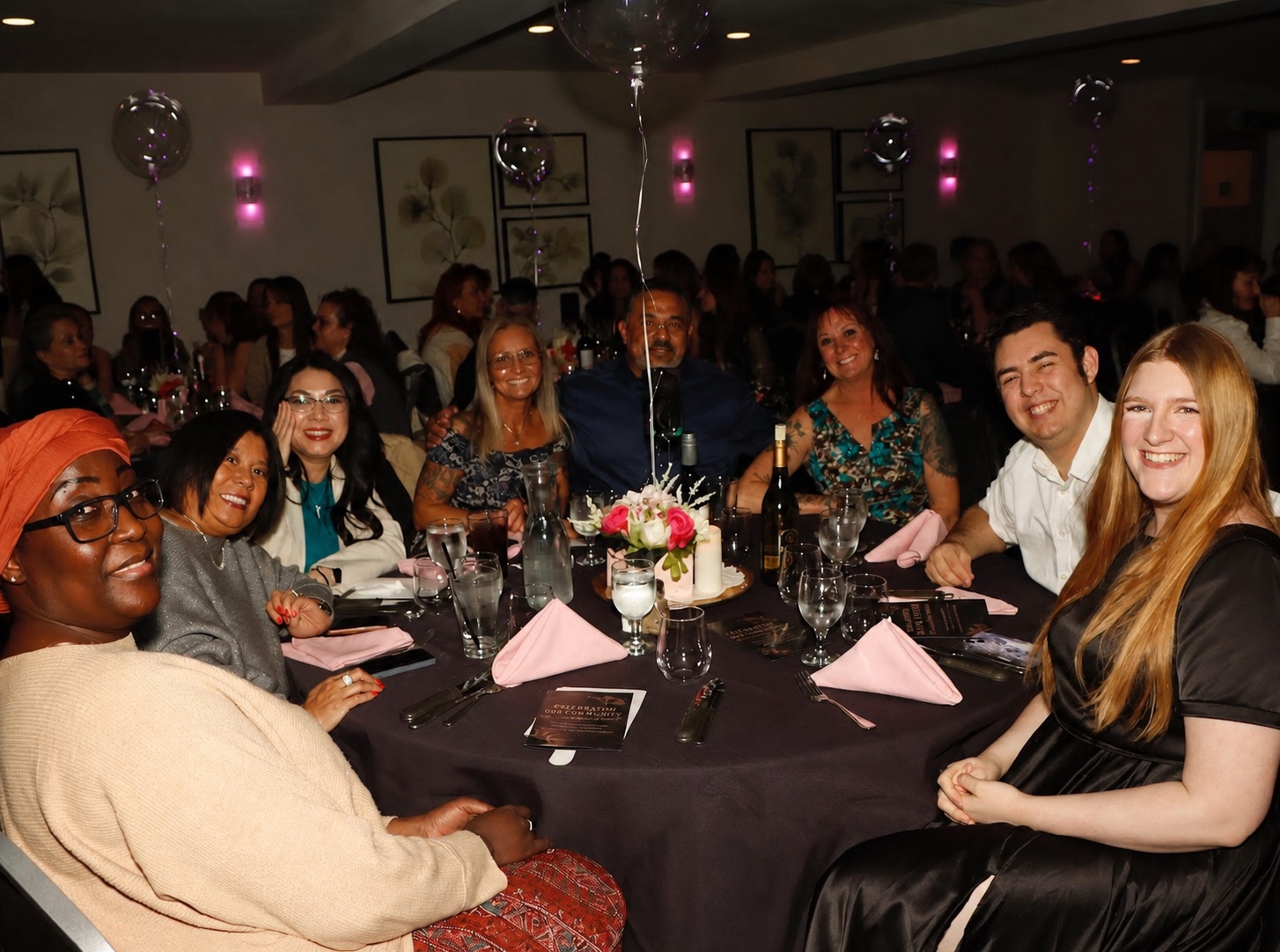 Adam and Carly Leveille with community members at a nonprofit gala.