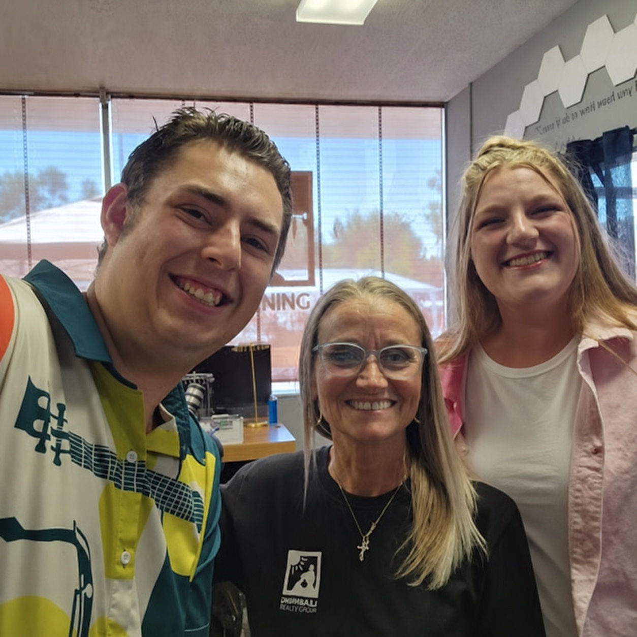 Adam and Carly Leveille with a Learning How community leader.
