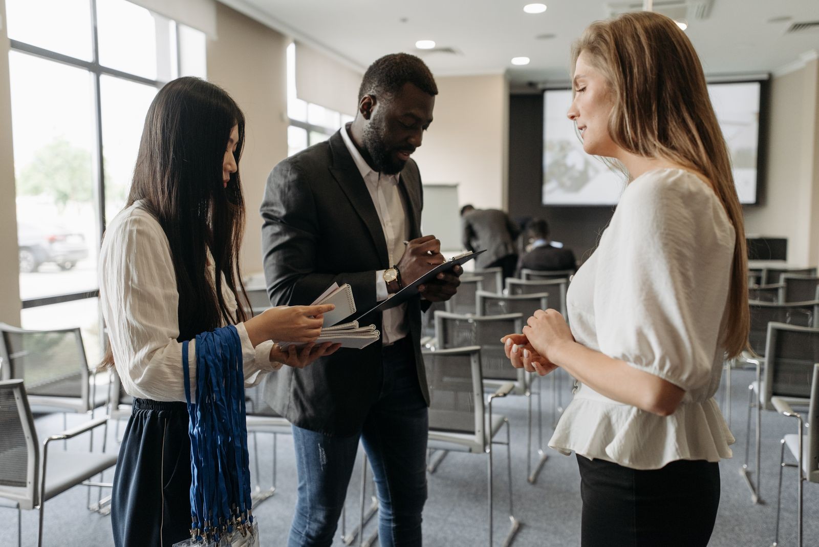 Professionals exchanging ideas at a conference.